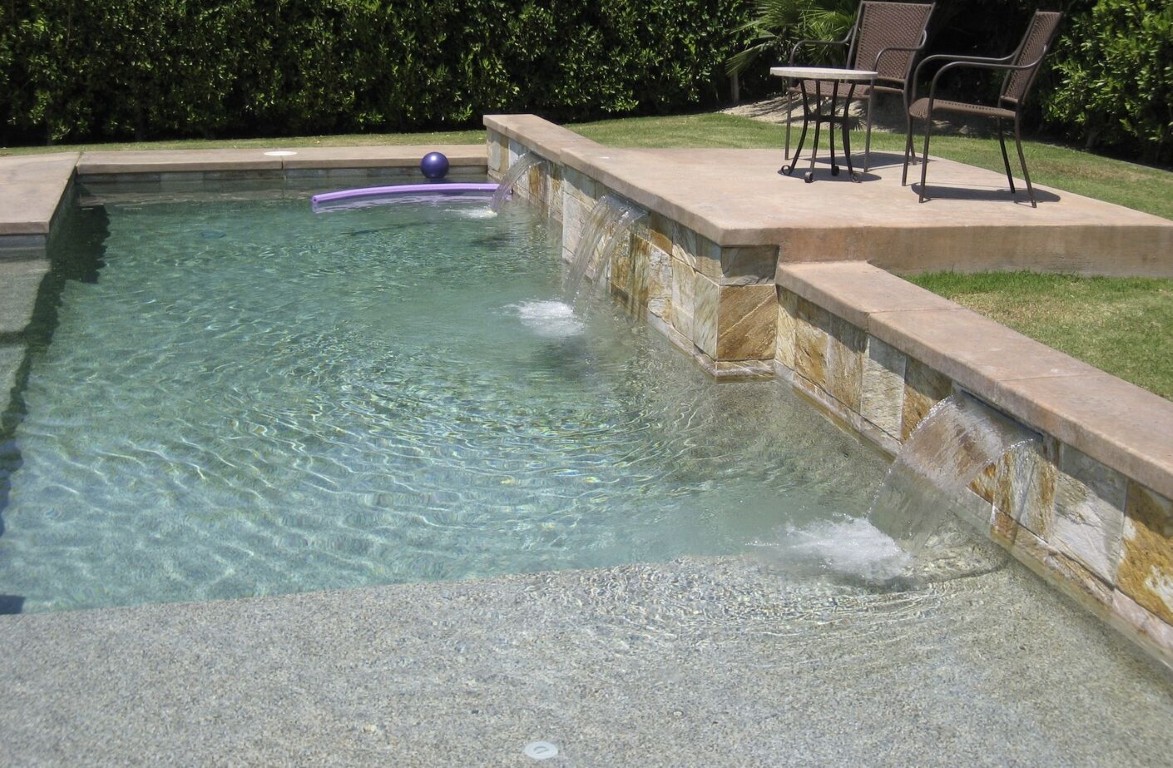 Professional pool cleaning showing waterfall feature in San Mateo, CA